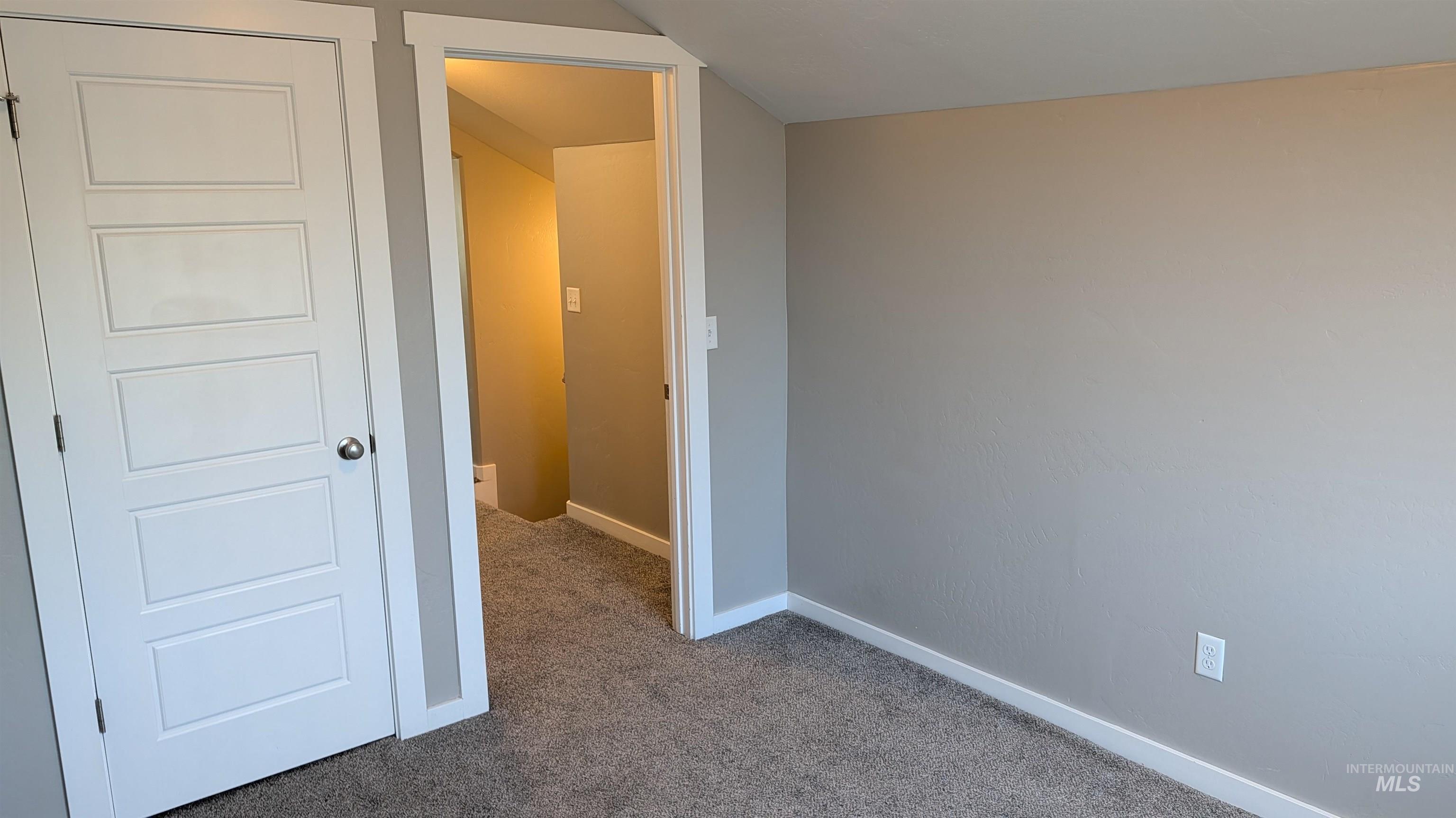 622 Lochsa Loop Heyburn, ID 83336 - Photo 13 of 17 Neutral-toned walls complement the textured gray carpeting