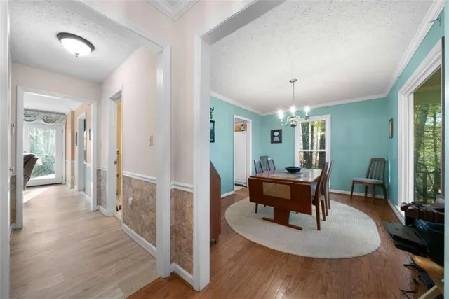 a view of a livingroom with furniture window and wooden floor