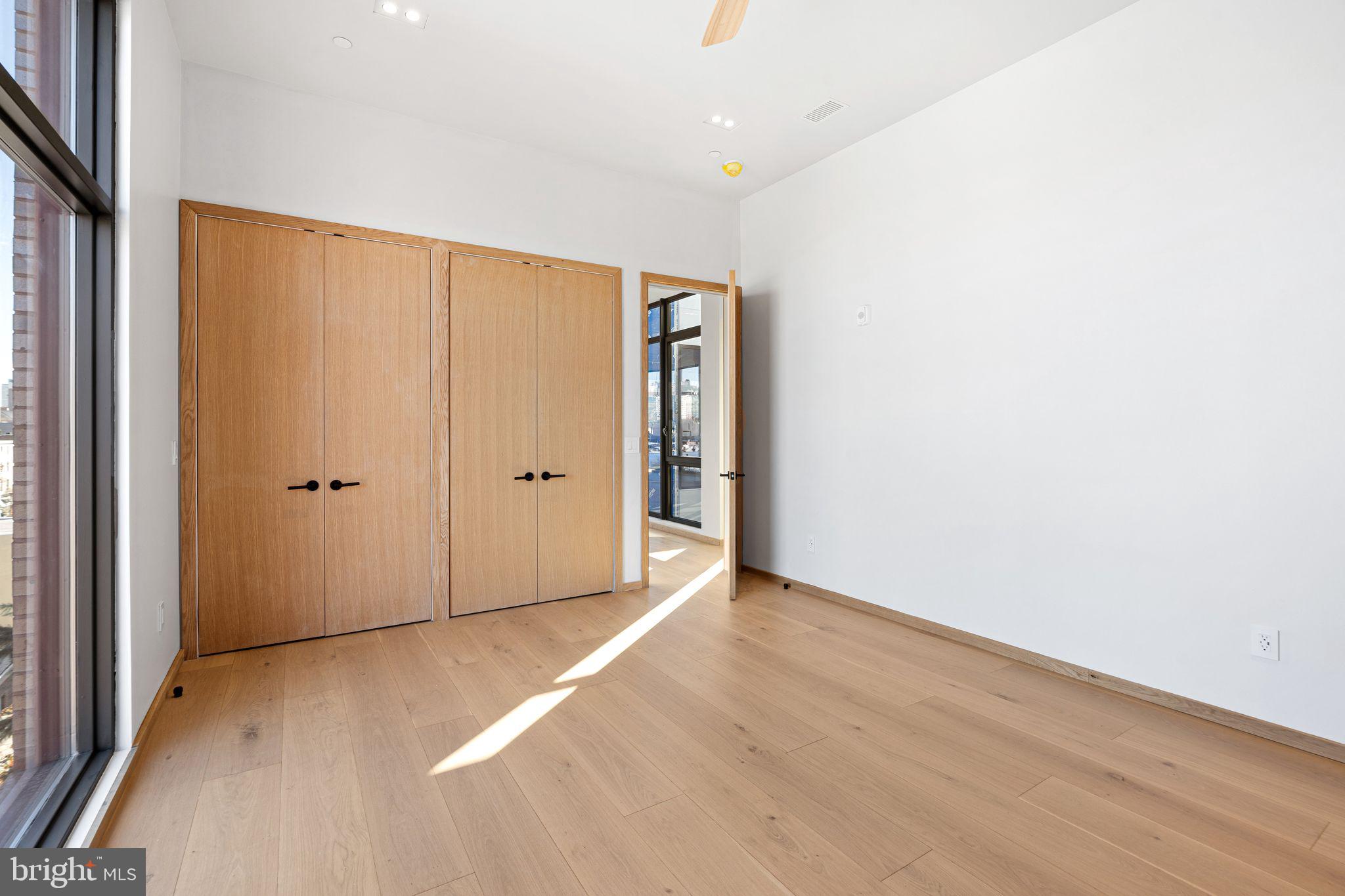 617 South 24th Street, Unit 501 Philadelphia, PA 19146 - Photo 25 of 36 a view of an empty room with wooden floor