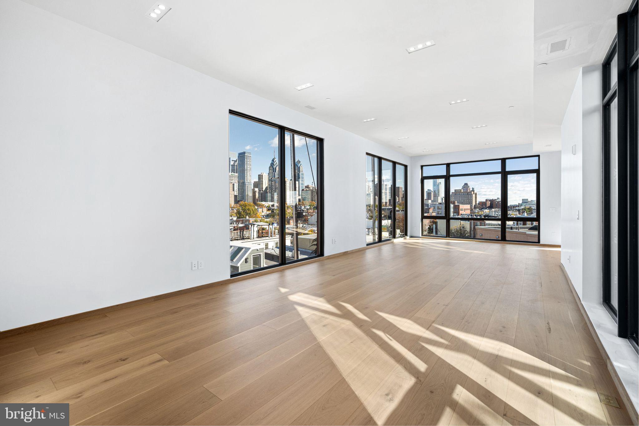 617 South 24th Street, Unit 501 Philadelphia, PA 19146 - Photo 6 of 36 wooden floor in an empty room with a window