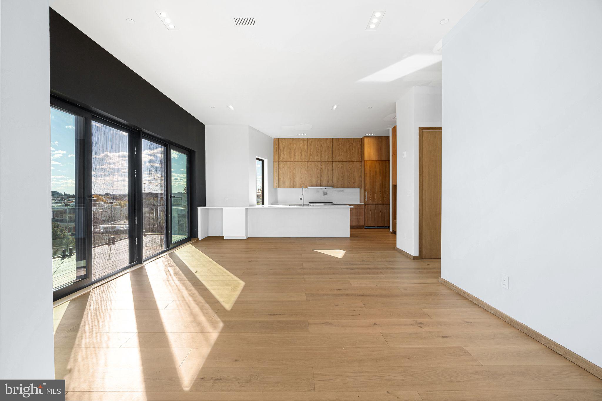 617 South 24th Street, Unit 501 Philadelphia, PA 19146 - Photo 10 of 36 a spacious bedroom with a large bed and a large window