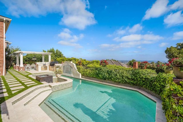 a view of a swimming pool with a patio