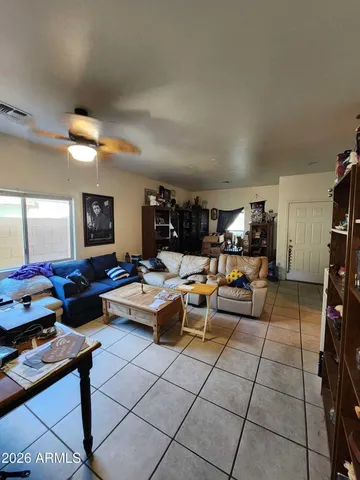 a living room with lots of furniture and a table