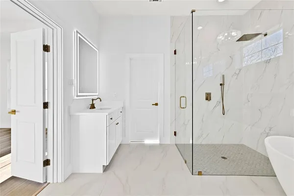 a bathroom with a shower and a tub