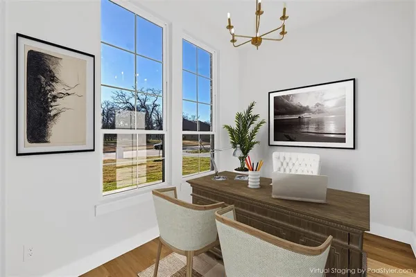a dining room with a table and chairs