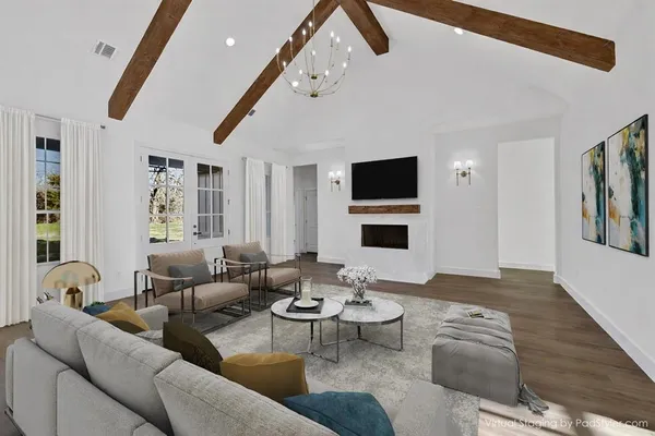a living room with furniture fireplace and a flat screen tv