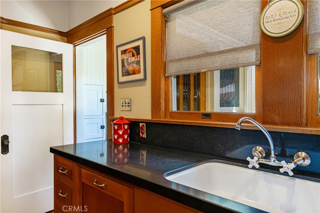 155 North Cleveland Street Orange, CA 92866 - Photo 13 of 39 a bathroom with a sink a large mirror and a window