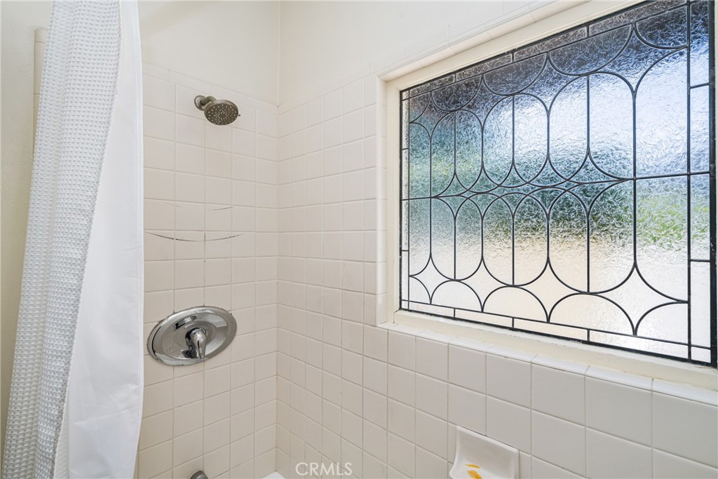 155 North Cleveland Street Orange, CA 92866 - Photo 20 of 39 a bathroom with a shower and a shower
