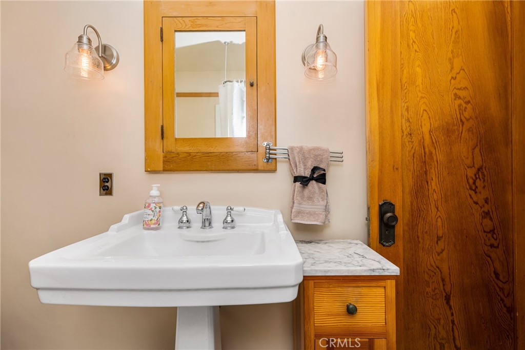 155 North Cleveland Street Orange, CA 92866 - Photo 28 of 39 a bathroom with a sink and a mirror