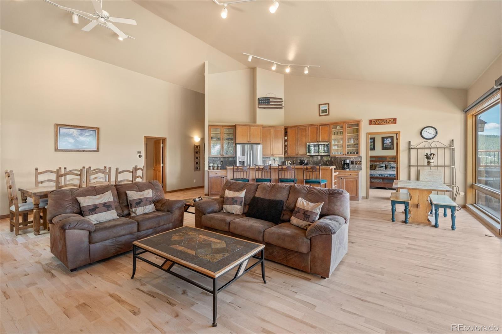92 Emmett Lode Road, Unit B Breckenridge, CO 80424 - Photo 9 of 50 a living room with furniture kitchen view and a table