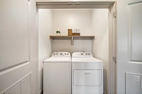 a utility room with dryer and washer