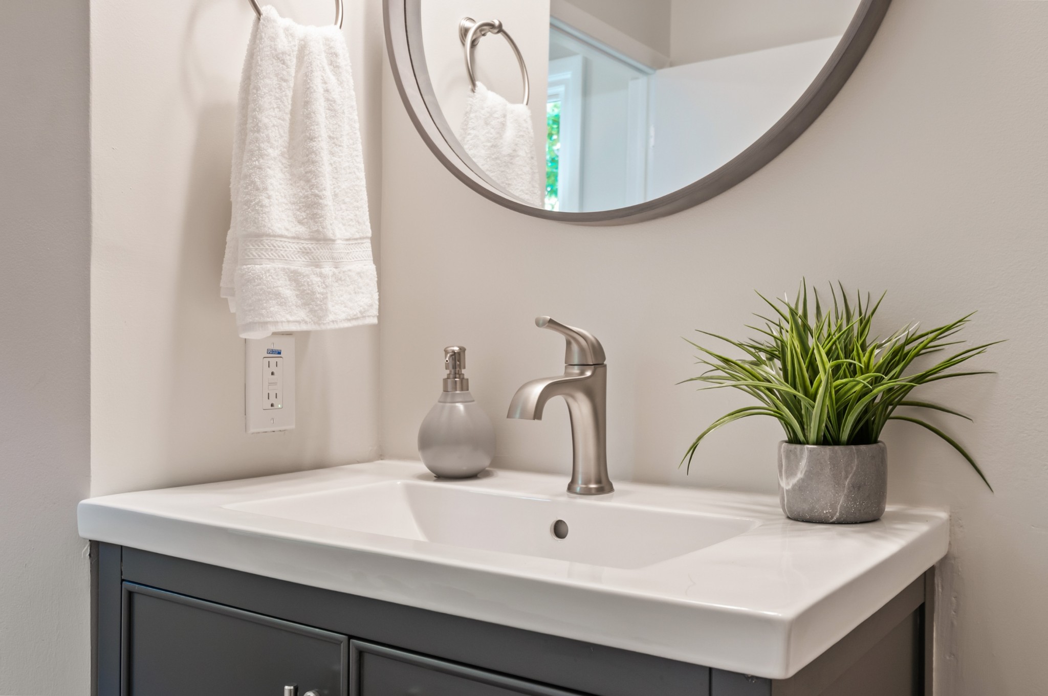 549 Elysian Fields Road Nashville, TN 37211 - Photo 11 of 17 a bathroom with a sink a mirror and a potted plant