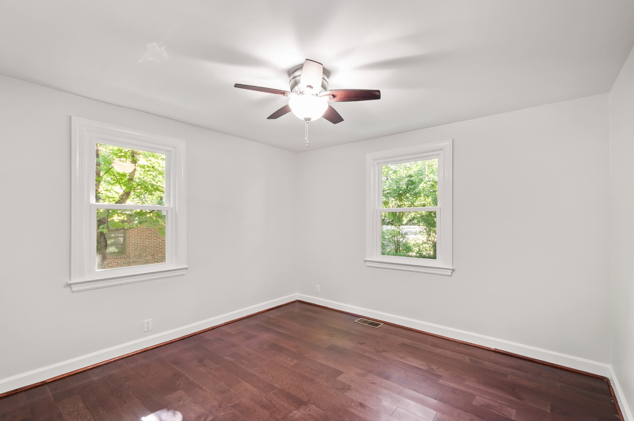 549 Elysian Fields Road Nashville, TN 37211 - Photo 12 of 17 a view of an empty room with wooden floor and a window