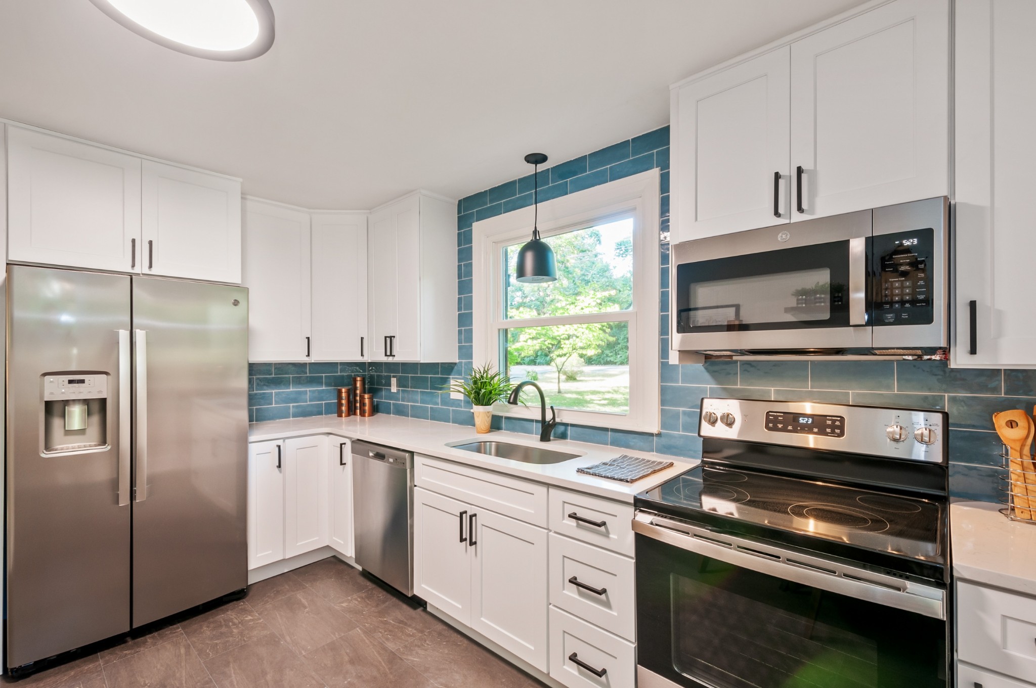 549 Elysian Fields Road Nashville, TN 37211 - Photo 5 of 17 a kitchen with a stove microwave and refrigerator