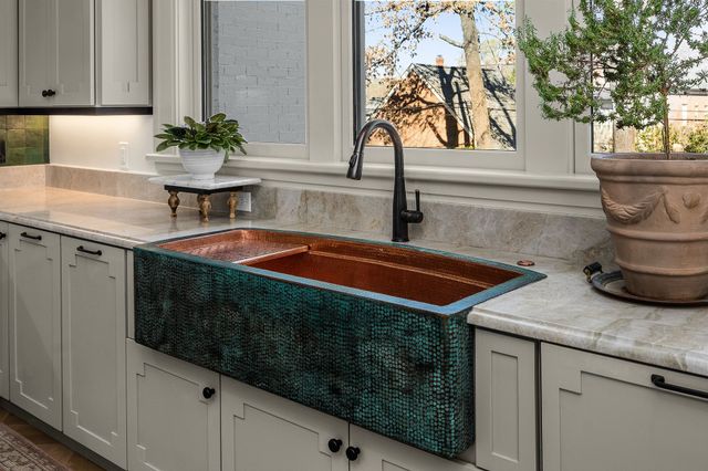 a bathroom with a double vanity sink mirror and double