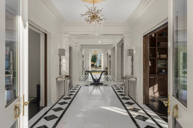 a kitchen with a potted plant on the counter and cabinets