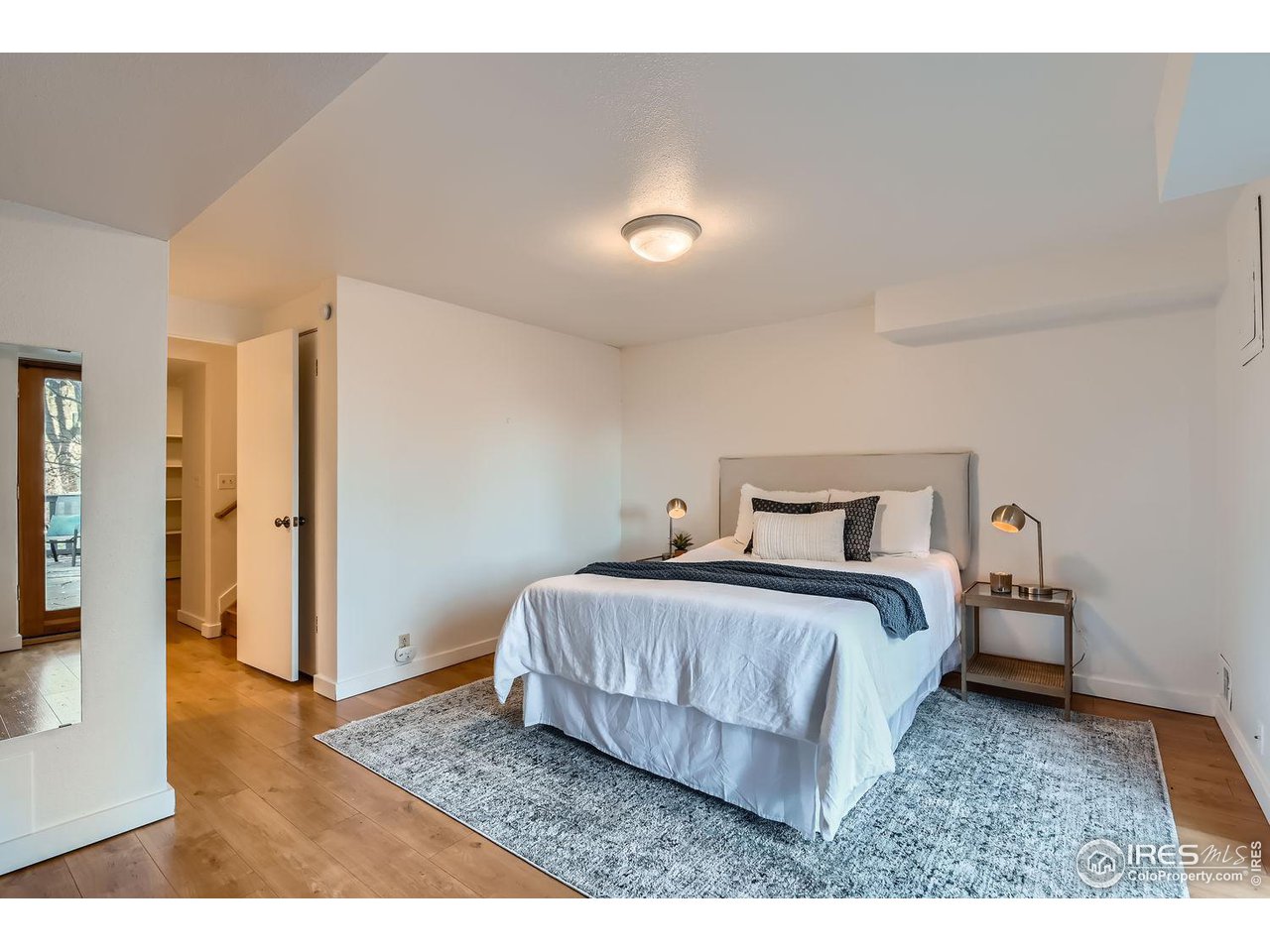 4150 Riverside Avenue Boulder, CO 80304 - Photo 13 of 40 a bedroom with a bed and a view of bathroom