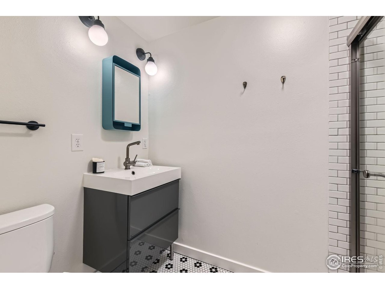4150 Riverside Avenue Boulder, CO 80304 - Photo 15 of 40 a bathroom with a sink vanity and a mirror