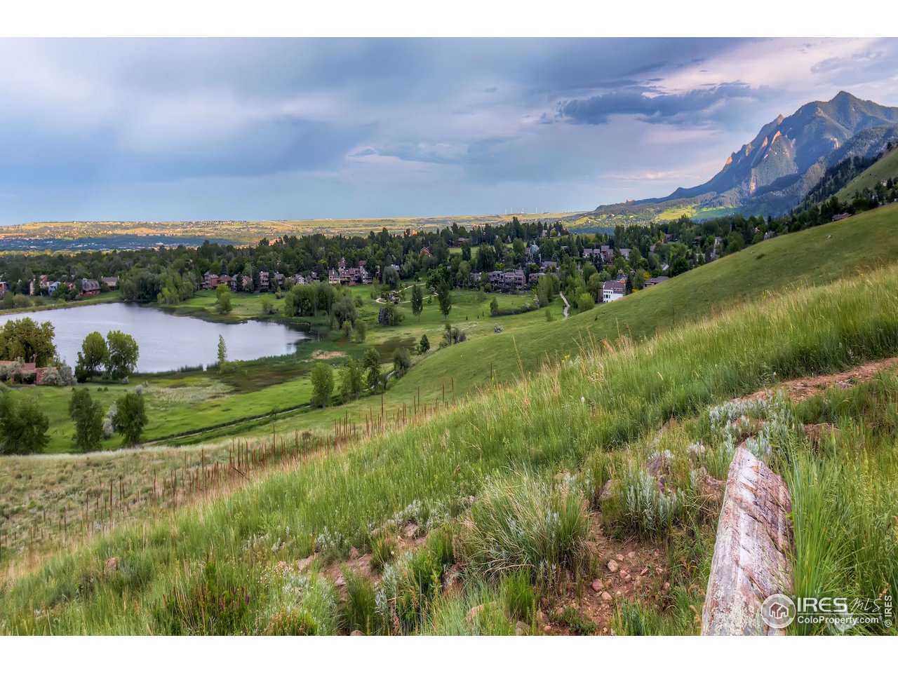 4150 Riverside Avenue Boulder, CO 80304 - Photo 26 of 40 a view of a lake with houses in back