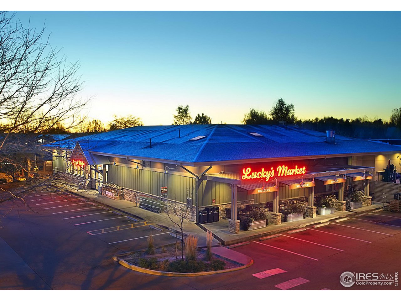 4150 Riverside Avenue Boulder, CO 80304 - Photo 31 of 40 a view of a patio with table and chairs under an umbrella
