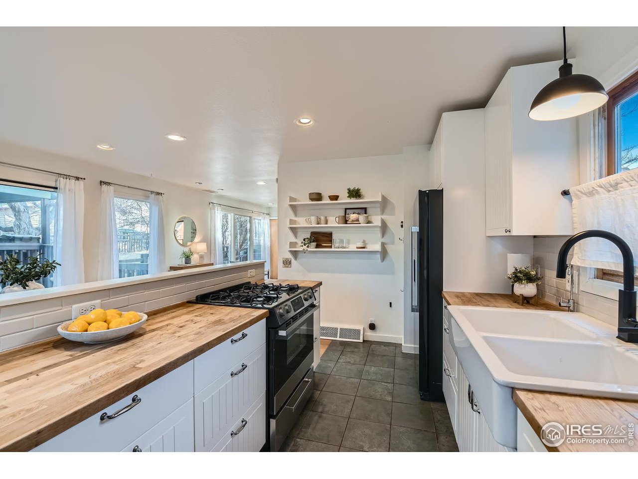4150 Riverside Avenue Boulder, CO 80304 - Photo 5 of 40 a kitchen with stainless steel appliances granite countertop a sink stove and refrigerator