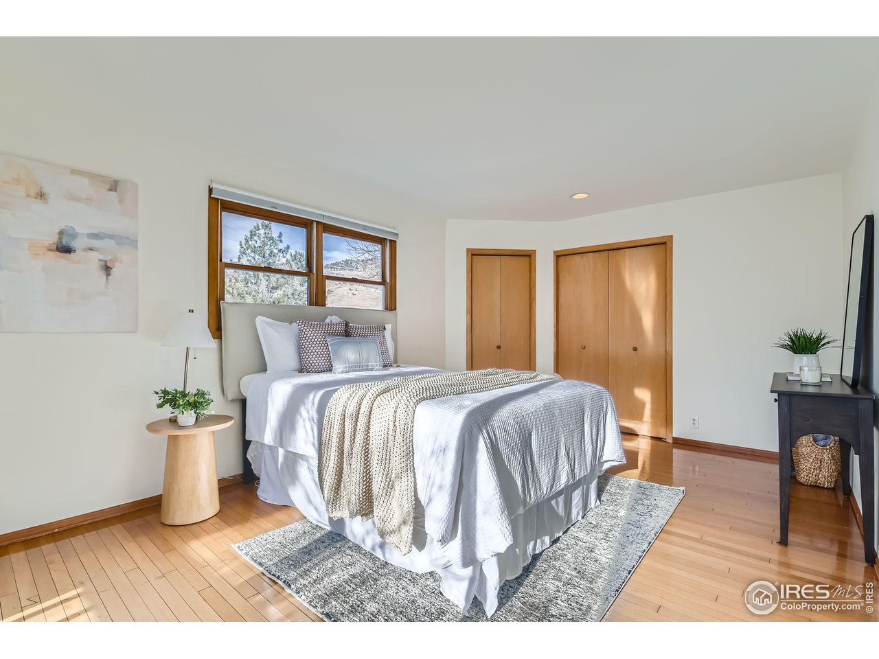 4150 Riverside Avenue Boulder, CO 80304 - Photo 7 of 40 a bed sitting in a spacious bedroom next to a window
