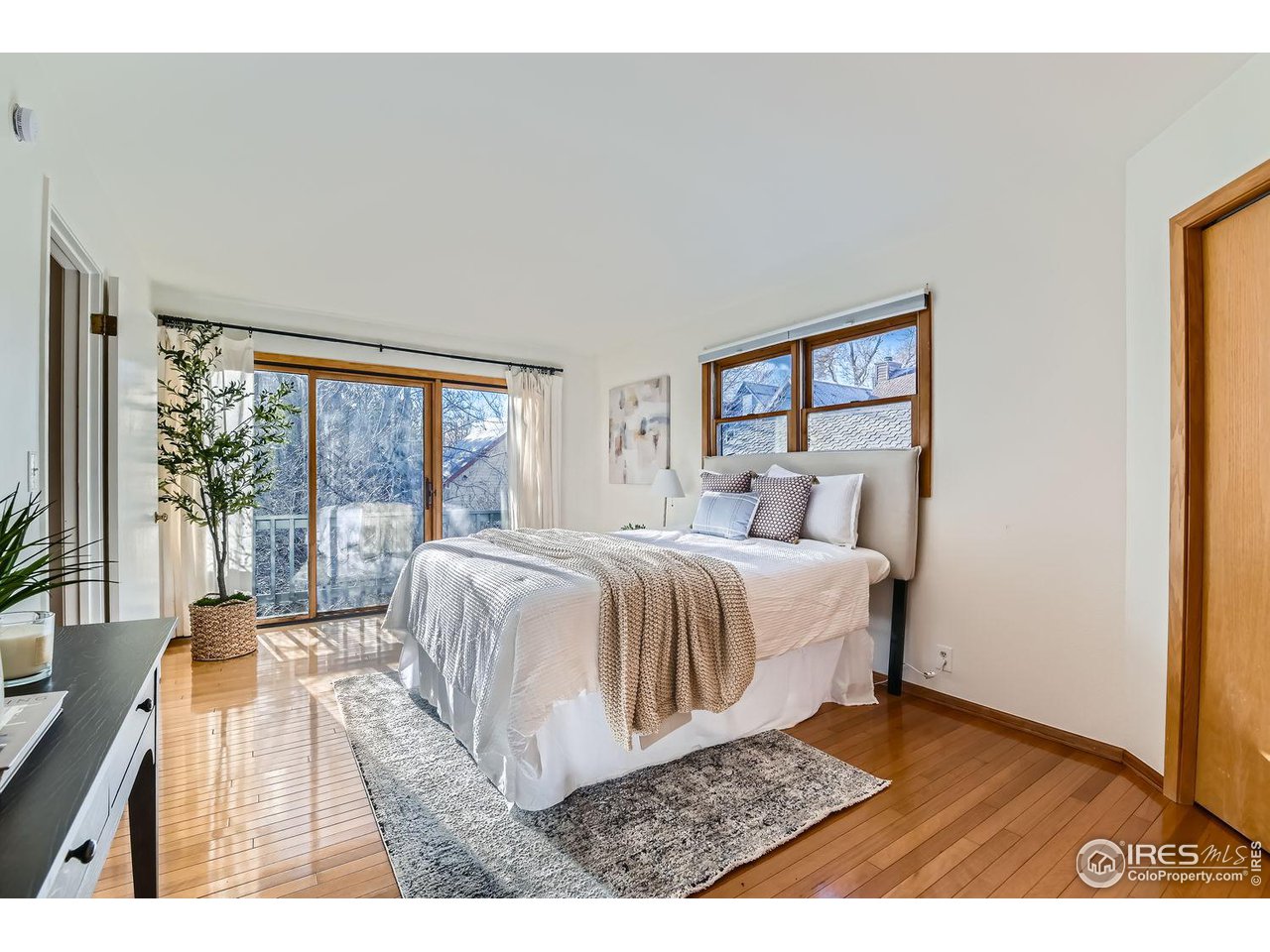 4150 Riverside Avenue Boulder, CO 80304 - Photo 8 of 40 a bedroom with a bed and a large window