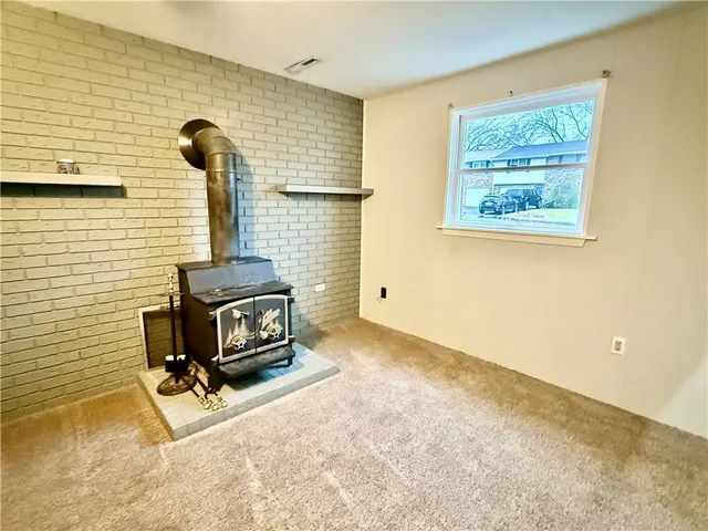a view of a house with wooden deck