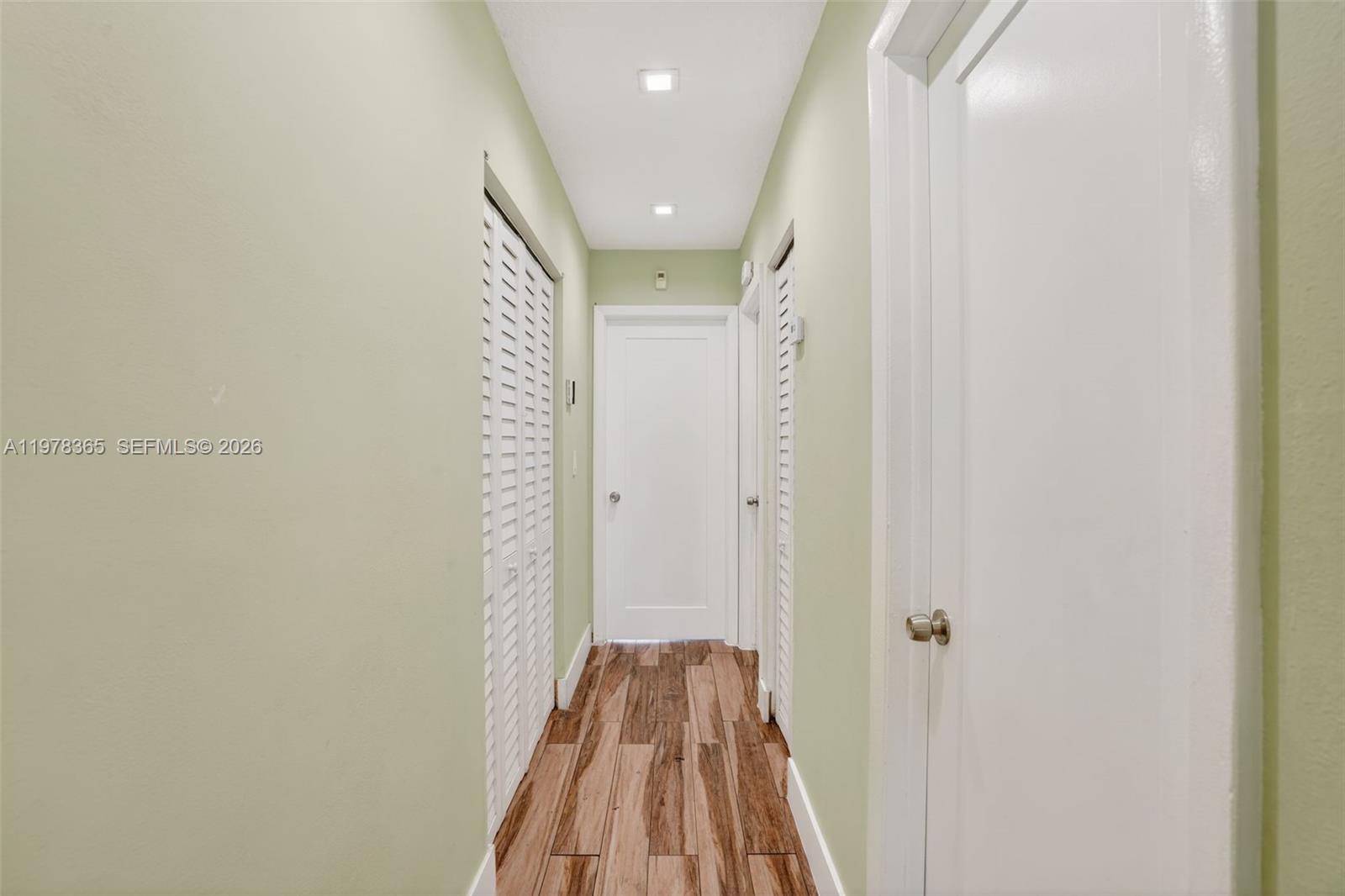 7016 Southwest 103rd Place Miami, FL 33173 - Photo 14 of 21 a view of a hallway with wooden floor and closet