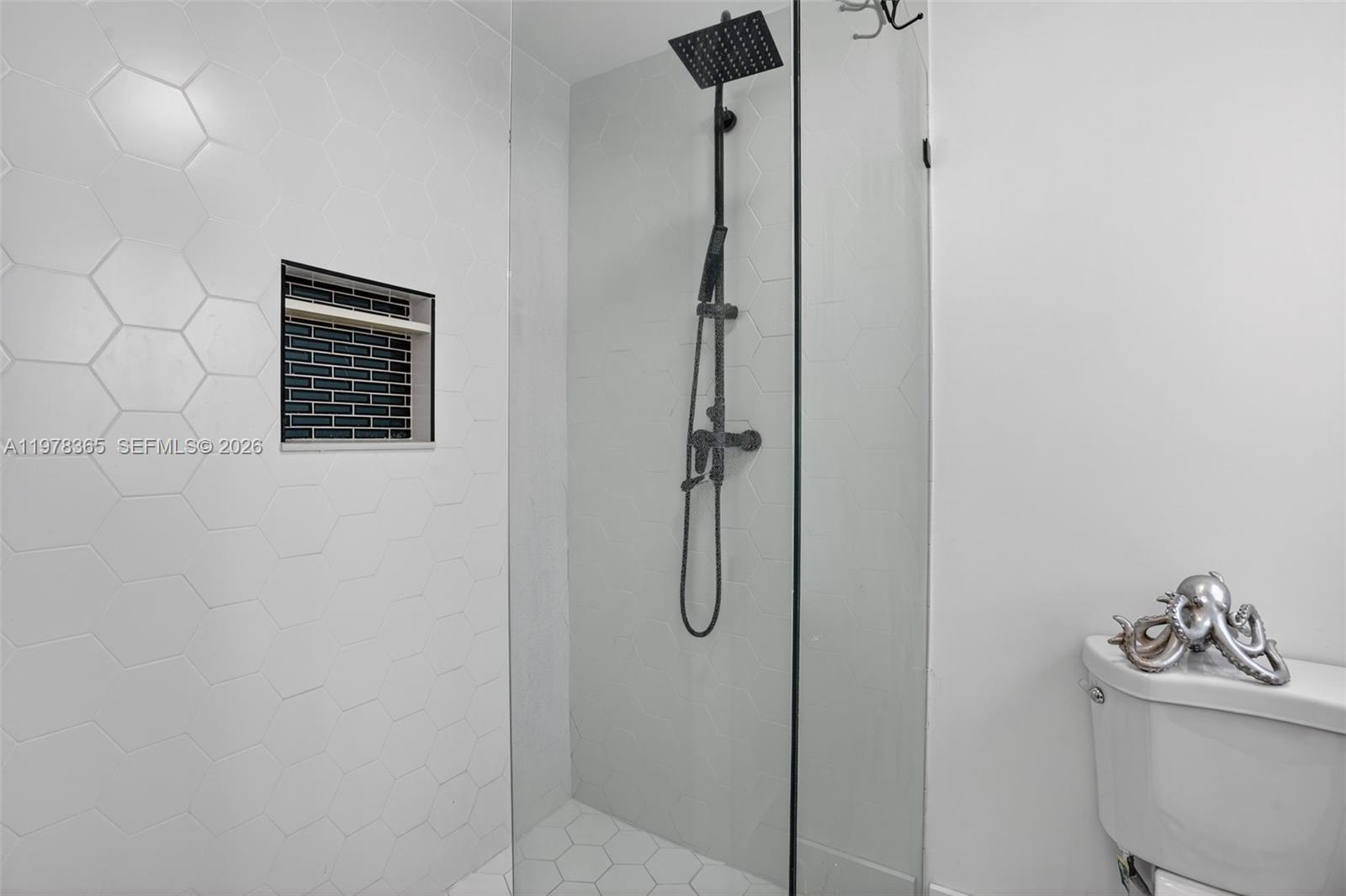 7016 Southwest 103rd Place Miami, FL 33173 - Photo 18 of 21 a bathroom with a shower