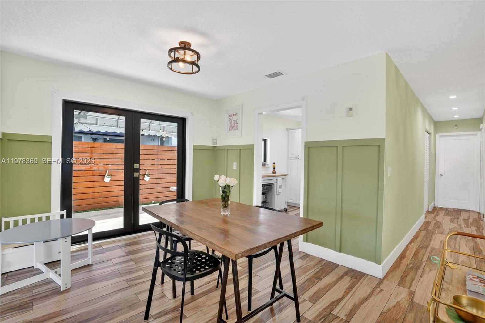 7016 Southwest 103rd Place Miami, FL 33173 - Photo 6 of 21 a view of a dining room with furniture window and wooden floor