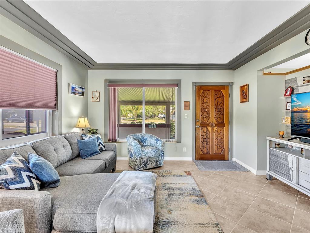5180 Southwest 13th Street Plantation, FL 33317 - Photo 11 of 54 a living room with furniture and a window