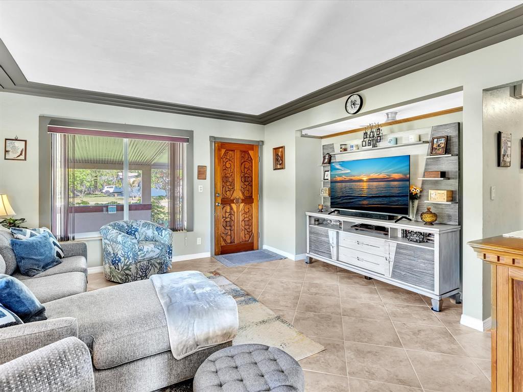 5180 Southwest 13th Street Plantation, FL 33317 - Photo 12 of 54 a living room with furniture and a flat screen tv