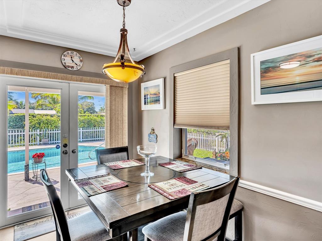 5180 Southwest 13th Street Plantation, FL 33317 - Photo 17 of 54 a view of a dining room with furniture window and outside view