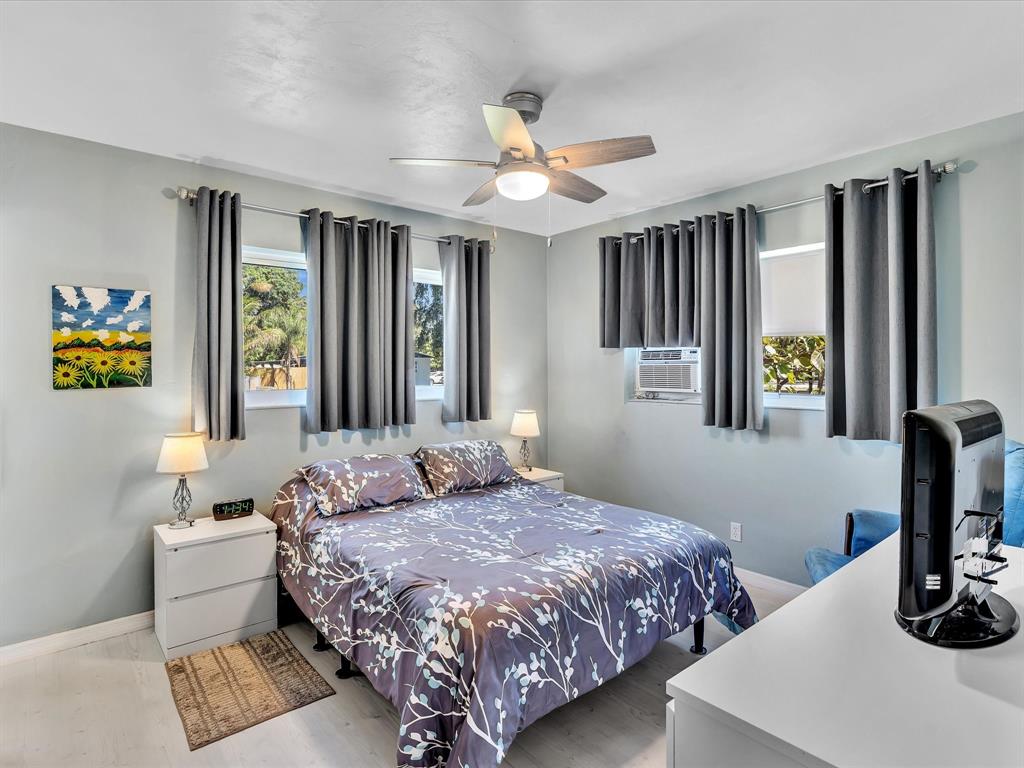 5180 Southwest 13th Street Plantation, FL 33317 - Photo 22 of 54 a bedroom with a bed and a window