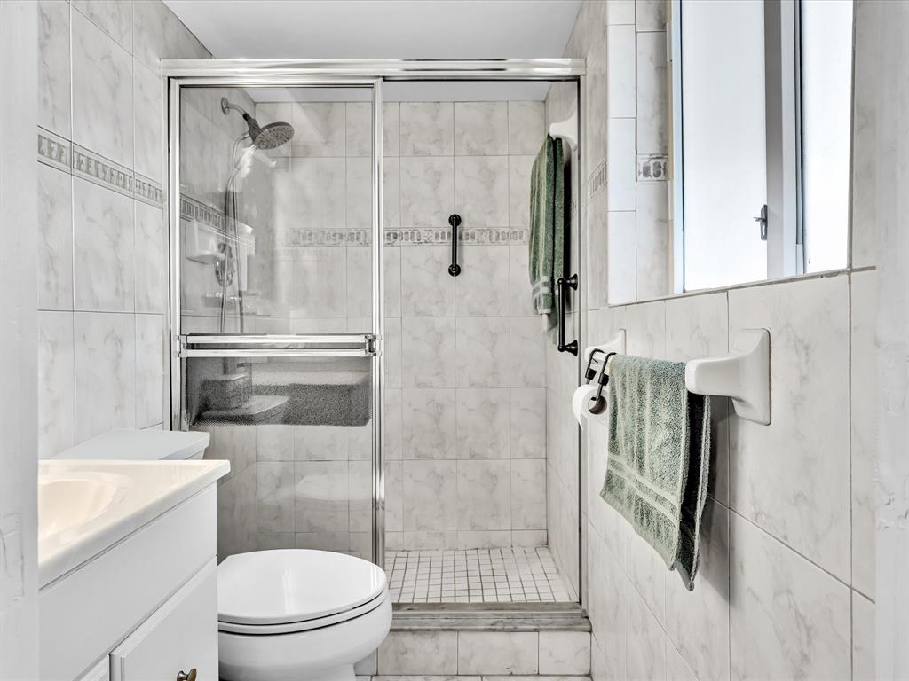 5180 Southwest 13th Street Plantation, FL 33317 - Photo 24 of 54 a bathroom with a shower and a toilet