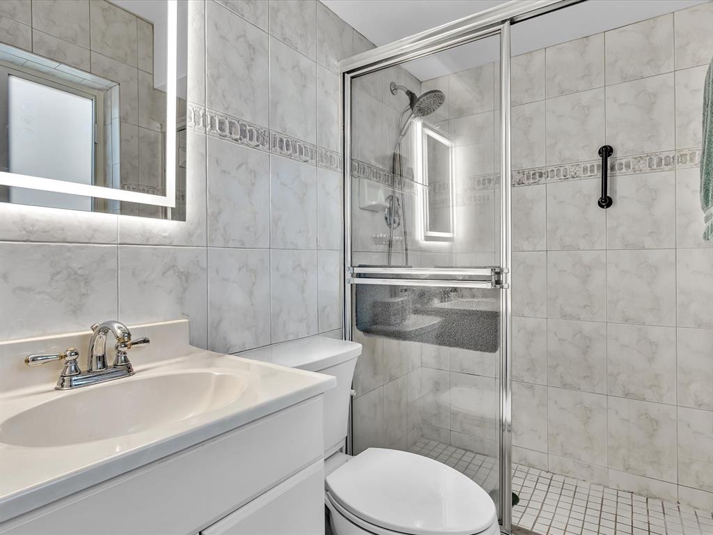 5180 Southwest 13th Street Plantation, FL 33317 - Photo 25 of 54 a bathroom with a sink toilet and shower