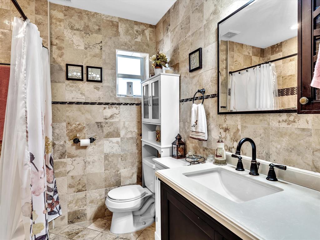 5180 Southwest 13th Street Plantation, FL 33317 - Photo 30 of 54 a bathroom with a sink toilet and shower