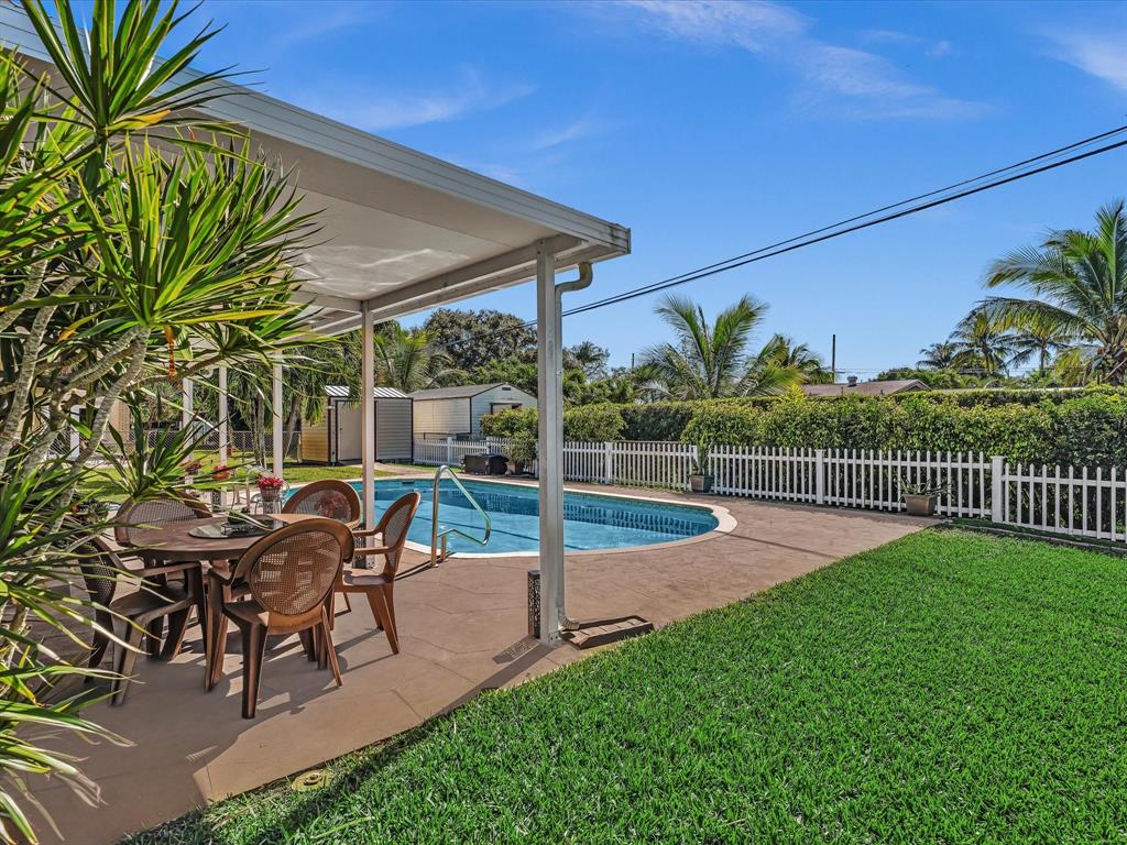 5180 Southwest 13th Street Plantation, FL 33317 - Photo 34 of 54 a view of a chair and tables in the patio