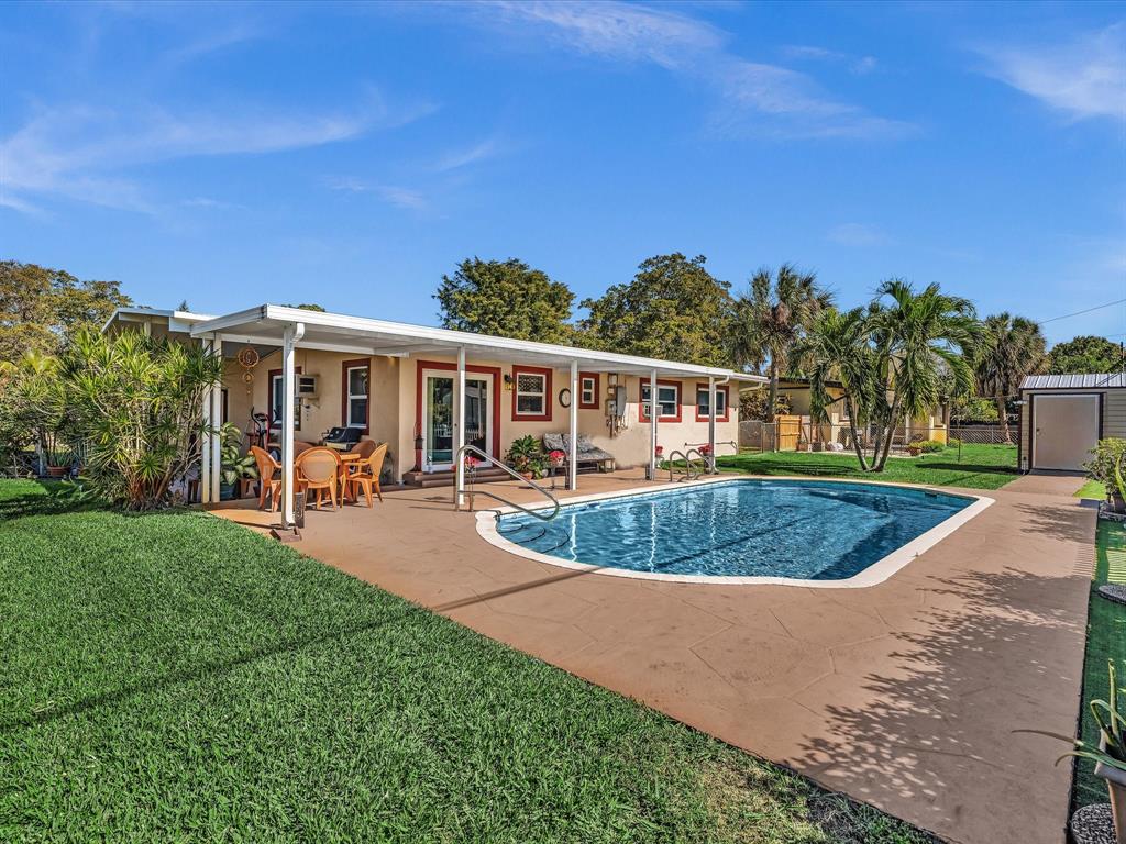 5180 Southwest 13th Street Plantation, FL 33317 - Photo 36 of 54 a view of a house with backyard porch and sitting area
