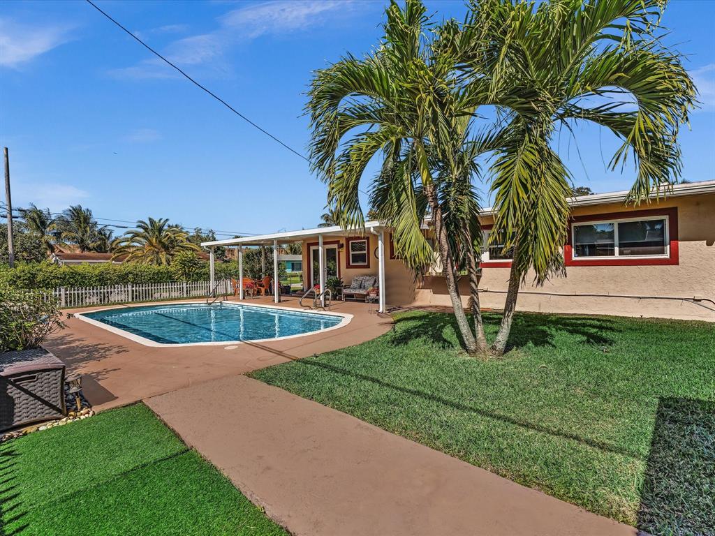 5180 Southwest 13th Street Plantation, FL 33317 - Photo 38 of 54 a view of a house with a swimming pool
