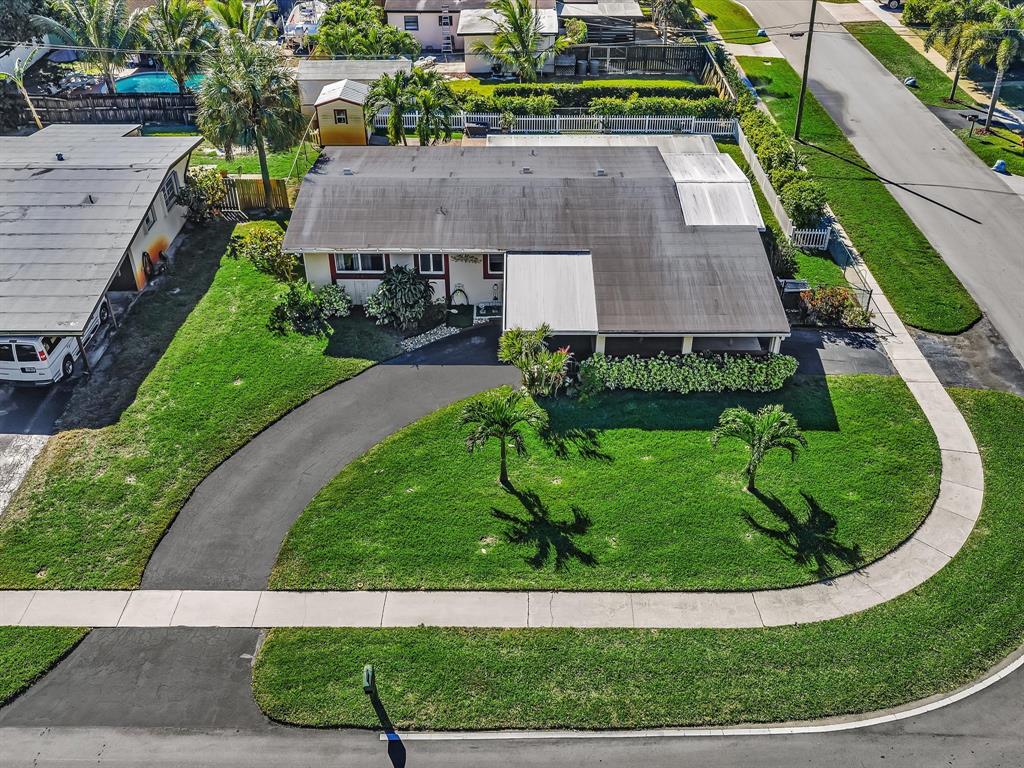 5180 Southwest 13th Street Plantation, FL 33317 - Photo 41 of 54 a aerial view of a house with a garden and trees