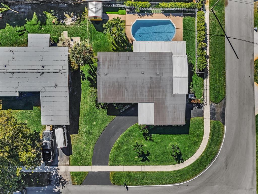 5180 Southwest 13th Street Plantation, FL 33317 - Photo 49 of 54 an aerial view of a house with a garden and plants