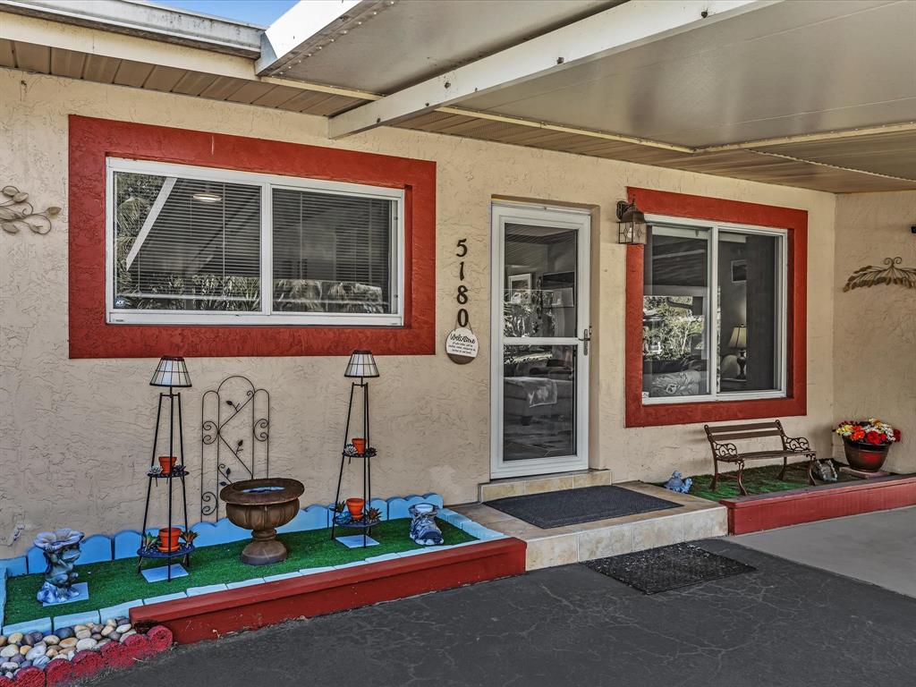 5180 Southwest 13th Street Plantation, FL 33317 - Photo 6 of 54 a front view of a house with garage
