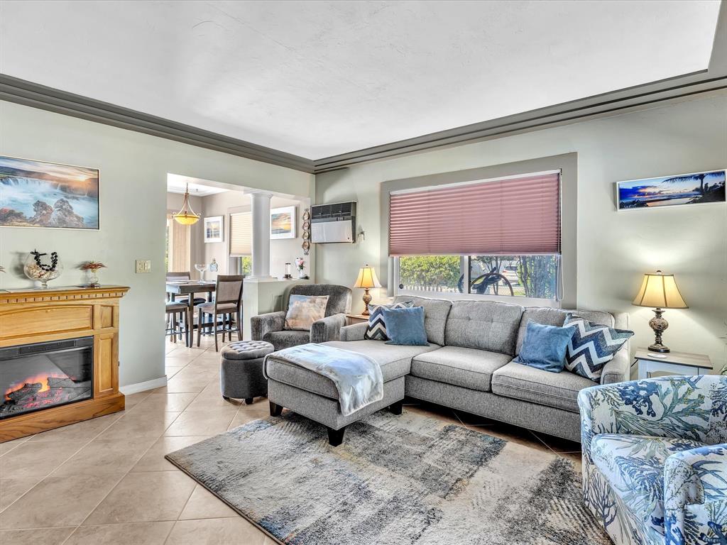 5180 Southwest 13th Street Plantation, FL 33317 - Photo 9 of 54 a living room with furniture and a fireplace