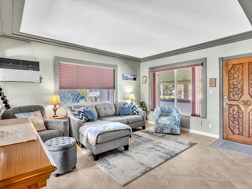 5180 Southwest 13th Street Plantation, FL 33317 - Photo 10 of 54 a living room with furniture and a window