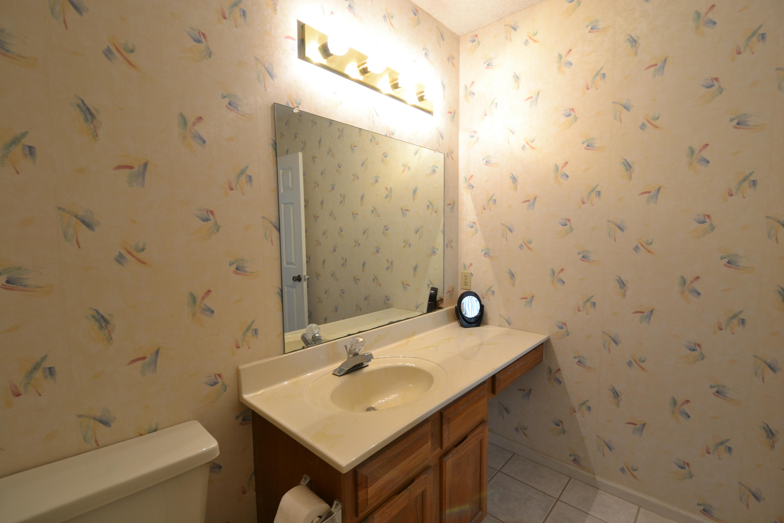 241 Ellis Road, Unit 29 Miramar Beach, FL 32550 - Photo 14 of 19 a bathroom with a sink a toilet and shower
