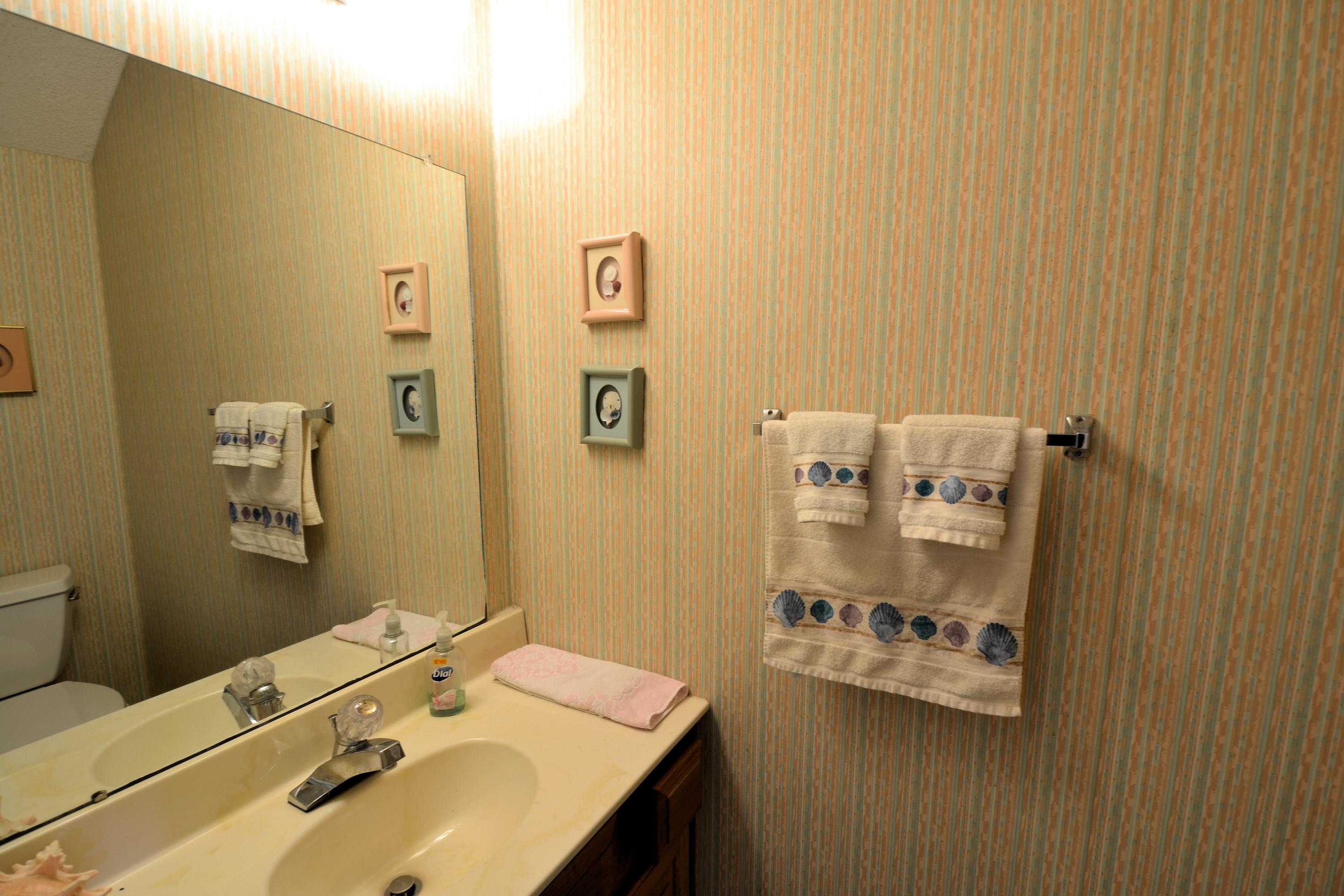 241 Ellis Road, Unit 29 Miramar Beach, FL 32550 - Photo 9 of 19 a bathroom with a sink and mirror