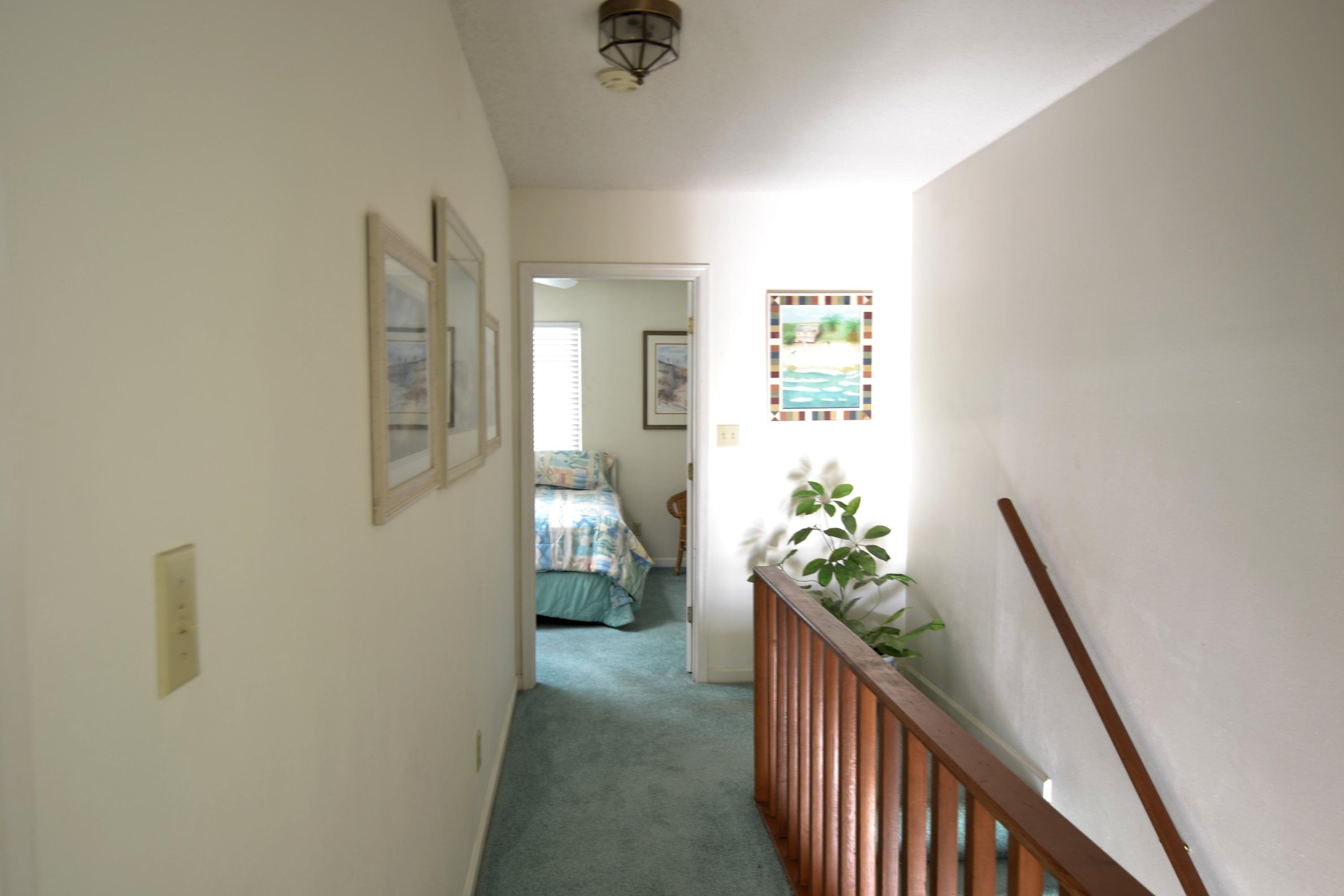 241 Ellis Road, Unit 29 Miramar Beach, FL 32550 - Photo 10 of 19 a view of hallway with wooden floor