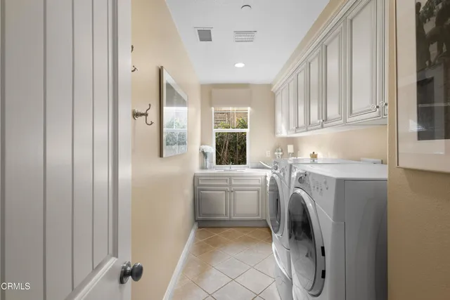 a kitchen with refrigerator and washer